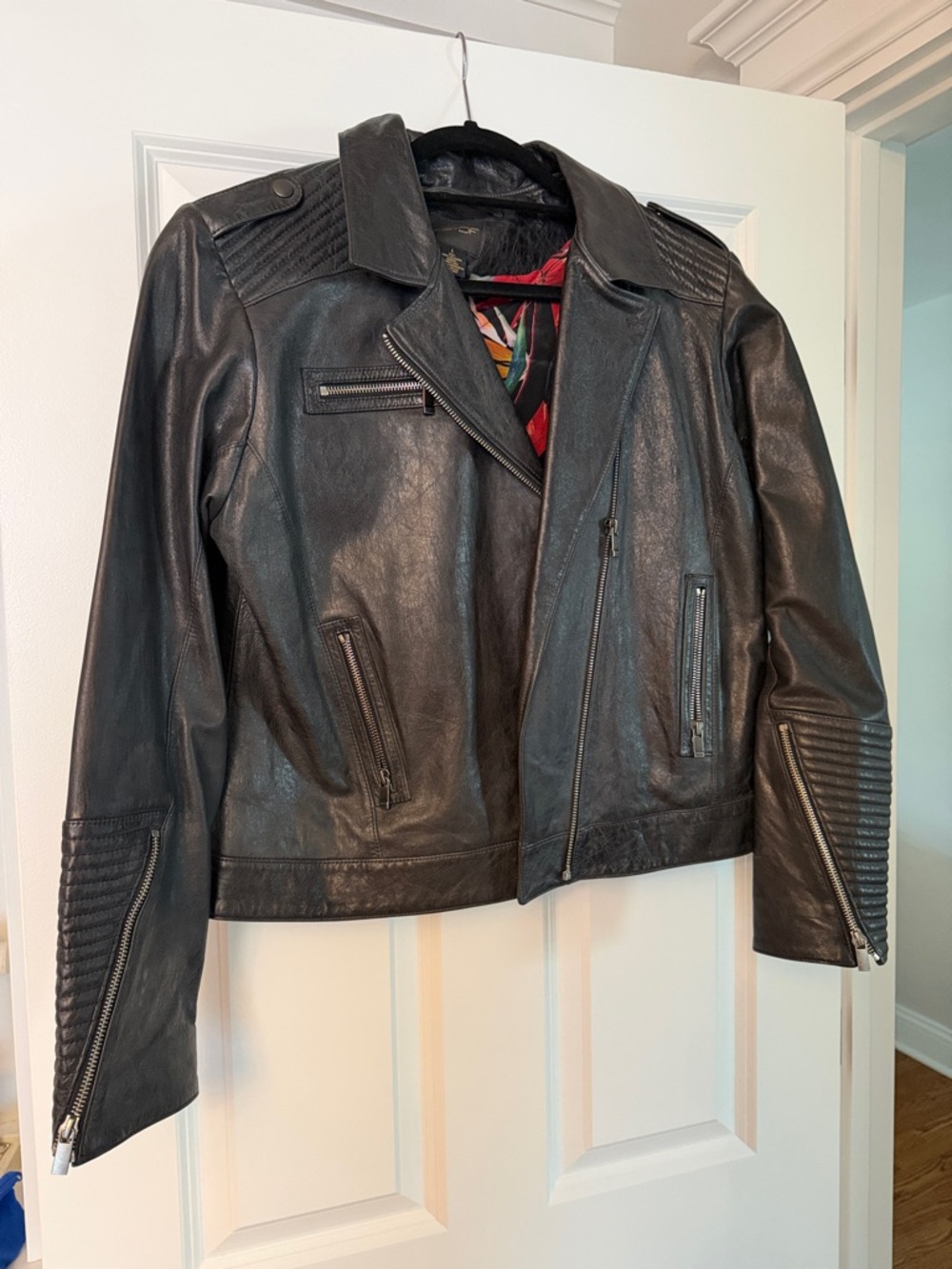 Classic Black Leather Moto Jacket with zippers and stud details